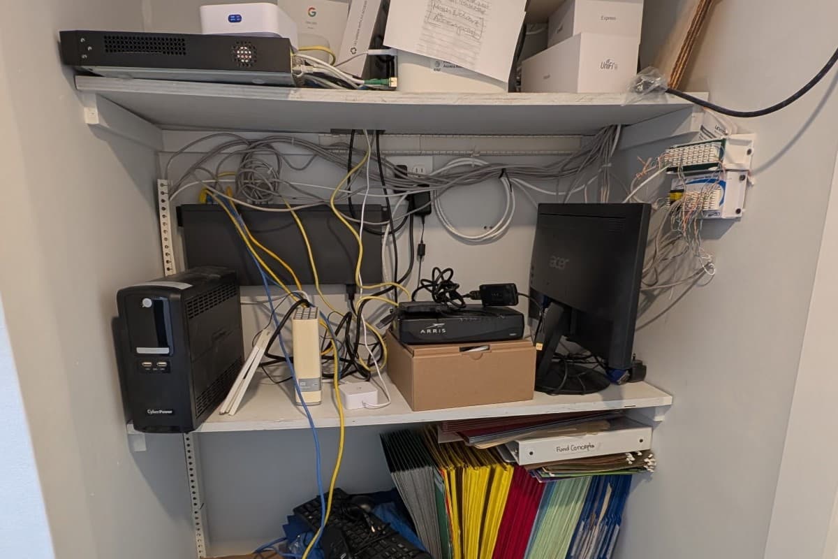 Before — loose cables, stacked switches, no organization